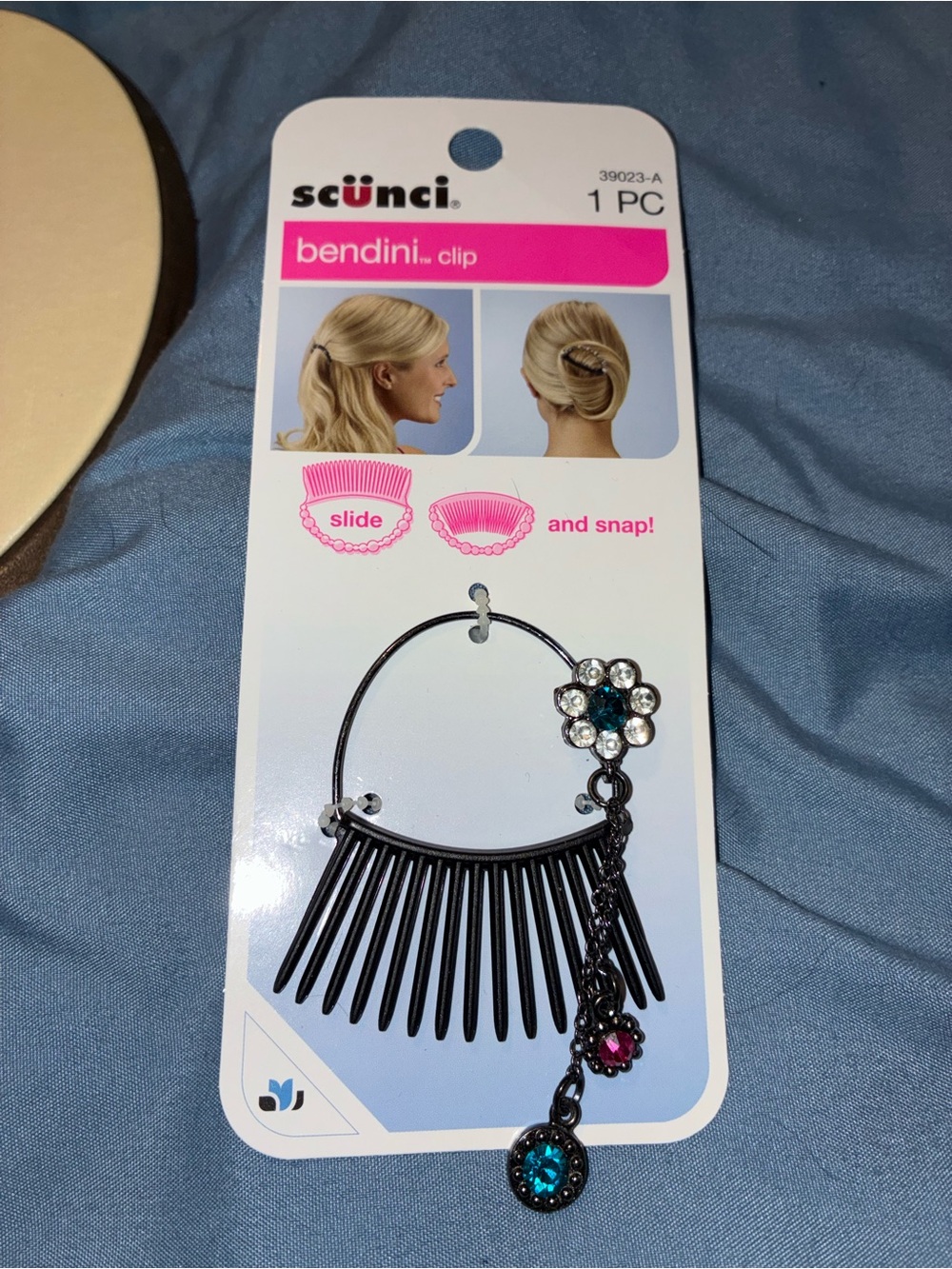 scunci black hair bendini clip with blue and pink gem accents